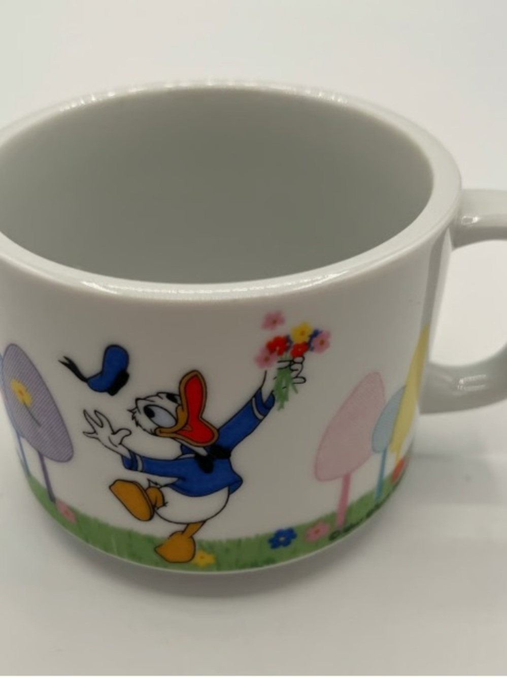 White Ceramic Cartoon Character Mug with Colorful Accent